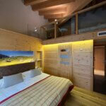 Onze familiekamer in Een fijne familiekamer van Hotel Nendaz 4 Vallees & Spa.